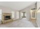 Cozy living room with a brick fireplace and views of the front door entrance at 2515 S Maple Ave # 103, Tempe, AZ 85282