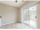Living room with tile floors and sliding glass doors that lead to an outdoor patio at 2515 S Maple Ave # 103, Tempe, AZ 85282