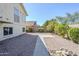 Low-maintenance backyard featuring decorative rock and mature trees, offering a private oasis for relaxation at 2629 E Verbena Dr, Phoenix, AZ 85048