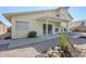 View of the backyard with a covered patio, desert landscape, and access to the home at 2629 E Verbena Dr, Phoenix, AZ 85048