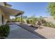 Charming backyard featuring a covered patio, desert landscaping, and privacy wall at 2629 E Verbena Dr, Phoenix, AZ 85048