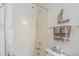 Clean bathroom with bathtub and shower, plus a decorative sailboat accent at 2629 E Verbena Dr, Phoenix, AZ 85048