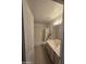 Bathroom featuring a tub/shower combination and a vanity with generous counter space at 2629 E Verbena Dr, Phoenix, AZ 85048