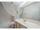 Bathroom with sink and vanity, plus shower with curtain and decorative lighting at 2629 E Verbena Dr, Phoenix, AZ 85048