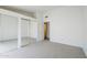 Bright bedroom features mirrored closet doors and neutral carpet for a clean, modern aesthetic at 2629 E Verbena Dr, Phoenix, AZ 85048
