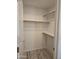 Organized closet features built-in shelving and rods, providing ample storage space for clothes and accessories at 2629 E Verbena Dr, Phoenix, AZ 85048