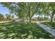 Lush community park featuring picnic tables, mature trees, and a walking path for residents at 2629 E Verbena Dr, Phoenix, AZ 85048