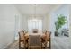Traditional dining room featuring a wood table with seating for six, enhanced by a stylish chandelier at 2629 E Verbena Dr, Phoenix, AZ 85048