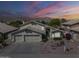 Beautiful two-story home featuring a three-car garage and meticulously maintained desert landscaping at 2629 E Verbena Dr, Phoenix, AZ 85048
