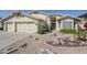 Well-maintained single-story home with desert-style landscaping and a welcoming entrance at 2629 E Verbena Dr, Phoenix, AZ 85048