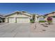 Attractive single-Gathering home featuring a three-car garage and desert landscaping at 2629 E Verbena Dr, Phoenix, AZ 85048