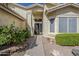 Inviting home entrance with mature landscaping and a paved walkway at 2629 E Verbena Dr, Phoenix, AZ 85048