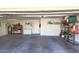 Spacious garage with ample storage, workbench, and extra freezer space for organization and hobbies at 2629 E Verbena Dr, Phoenix, AZ 85048