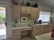 Bright kitchen area with workspace, tile countertops, and ample cabinet space at 2629 E Verbena Dr, Phoenix, AZ 85048