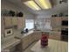 Functional kitchen featuring tile countertops, stainless steel appliances, and ample cabinet space at 2629 E Verbena Dr, Phoenix, AZ 85048