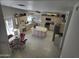 Open kitchen featuring an island, tile countertops and an adjoining dining area at 2629 E Verbena Dr, Phoenix, AZ 85048