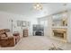 Inviting living room with fireplace, comfortable seating, and television at 2629 E Verbena Dr, Phoenix, AZ 85048