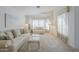 Inviting living room with bright lighting, soft neutral colors, and comfortable seating at 2629 E Verbena Dr, Phoenix, AZ 85048