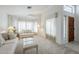 Cozy living room featuring neutral carpet, soft lighting, and comfortable seating at 2629 E Verbena Dr, Phoenix, AZ 85048