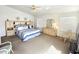 Bright primary bedroom with a vaulted ceiling and an ensuite bathroom at 2629 E Verbena Dr, Phoenix, AZ 85048