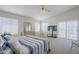 Spacious bedroom with natural light, slider door, and comfortable furnishings at 2629 E Verbena Dr, Phoenix, AZ 85048