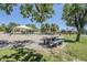 Playground with picnic tables shaded by mature trees surrounded by community green space at 2629 E Verbena Dr, Phoenix, AZ 85048