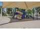 Shaded playground with climbing structure featuring multiple slides for outdoor play at 2629 E Verbena Dr, Phoenix, AZ 85048