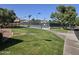 Enjoy a game of tennis at the community court, surrounded by beautiful landscaping and mature trees at 2629 E Verbena Dr, Phoenix, AZ 85048
