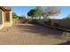 Expansive backyard features custom brickwork with bench seating and mature landscaping at 29462 N 126Th Ln, Peoria, AZ 85383