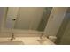Bright bathroom with a double sink, marble countertops, and modern fixtures at 29462 N 126Th Ln, Peoria, AZ 85383