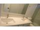 Bathroom featuring double sinks, quartz counters, and modern fixtures at 29462 N 126Th Ln, Peoria, AZ 85383