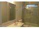 Modern bathroom featuring vanity with a quartz countertop, glass shower, and sleek fixtures for a spa-like feel at 29462 N 126Th Ln, Peoria, AZ 85383