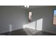 Bright bedroom featuring wood-look floors and sunny windows at 29462 N 126Th Ln, Peoria, AZ 85383