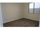 This bright bedroom has a new ceiling fan, neutral colored walls and plank flooring at 29462 N 126Th Ln, Peoria, AZ 85383