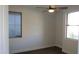 Clean and modern bedroom has updated ceiling fan, two windows, and plank flooring at 29462 N 126Th Ln, Peoria, AZ 85383