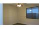 A well-lit bedroom features neutral walls, ceiling fan, and plank flooring at 29462 N 126Th Ln, Peoria, AZ 85383