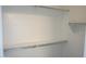 Walk-in closet features built-in shelving and rod for organized storage at 29462 N 126Th Ln, Peoria, AZ 85383