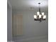 Dining room featuring stylish lighting and large window at 29462 N 126Th Ln, Peoria, AZ 85383