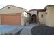 Inviting front exterior with a beautiful front door, garage and well-manicured landscaping at 29462 N 126Th Ln, Peoria, AZ 85383