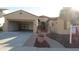 Inviting one-story home with desert landscaping, covered entry, and an attached two-car garage at 29462 N 126Th Ln, Peoria, AZ 85383