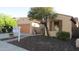 Charming single-story home featuring a well-manicured yard, inviting curb appeal, and a for sale sign at 29462 N 126Th Ln, Peoria, AZ 85383