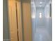 Bright hallway with pristine white marble floors at 29462 N 126Th Ln, Peoria, AZ 85383