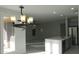 Gourmet kitchen featuring stainless appliances, white cabinets, and a large center island at 29462 N 126Th Ln, Peoria, AZ 85383