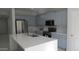 Well-equipped kitchen showcases stainless steel appliances, light cabinetry, and quartz countertops at 29462 N 126Th Ln, Peoria, AZ 85383