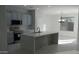 Sunlit kitchen featuring sleek countertops, modern appliances, and an open layout, ideal for entertaining at 29462 N 126Th Ln, Peoria, AZ 85383