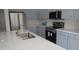 Close-up view of kitchen with stainless steel appliances and white countertops, perfect for any home chef at 29462 N 126Th Ln, Peoria, AZ 85383