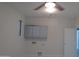 Bright laundry room featuring storage cabinets, utility hookups, ceiling fan and window at 29462 N 126Th Ln, Peoria, AZ 85383