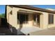 Covered patio area with tiled floor, open beam archway, and exterior access at 29462 N 126Th Ln, Peoria, AZ 85383