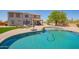 Large backyard features a pool, patio area, well-maintained lawn, and desert landscaping for outdoor living at 32525 N 41St Way, Cave Creek, AZ 85331