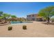 Spacious backyard with a large pool, lush landscaping, and room for recreation and relaxation at 32525 N 41St Way, Cave Creek, AZ 85331
